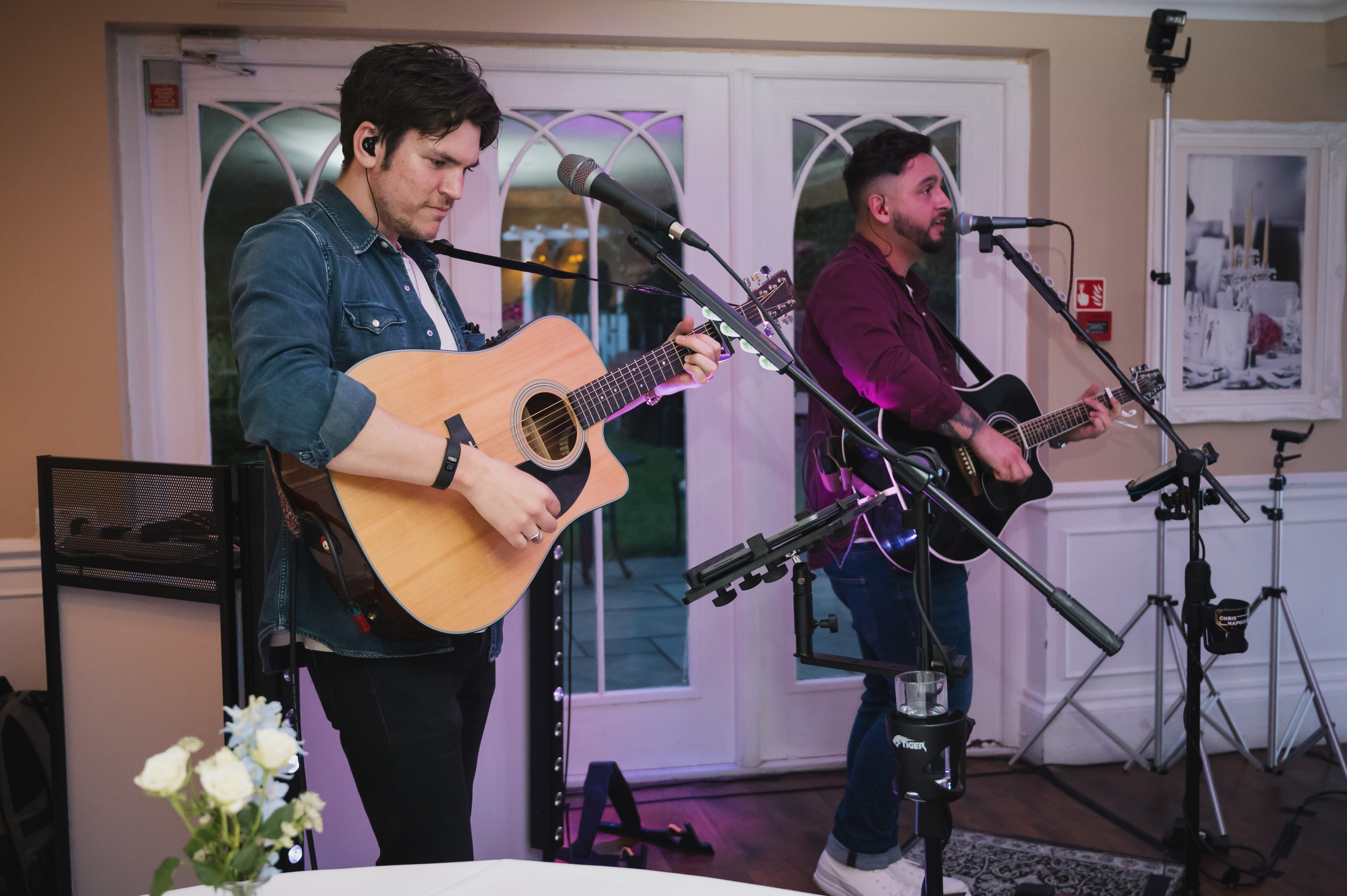 An acoustic duo playing live music in one of the rooms at Sheene Mill