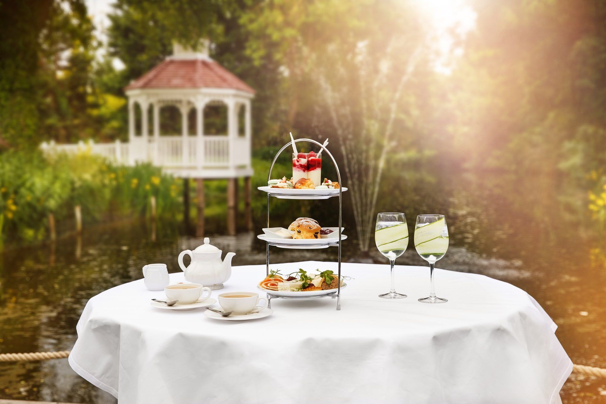 A three tier afternoon tea served beside the river at Sheene Mill, Cambridgeshire