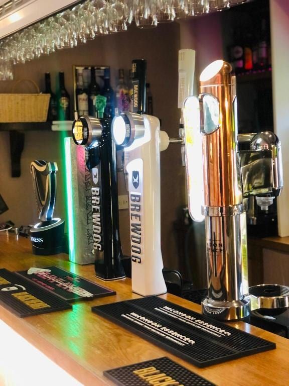 The draught taps at the bar at Sheene Mill