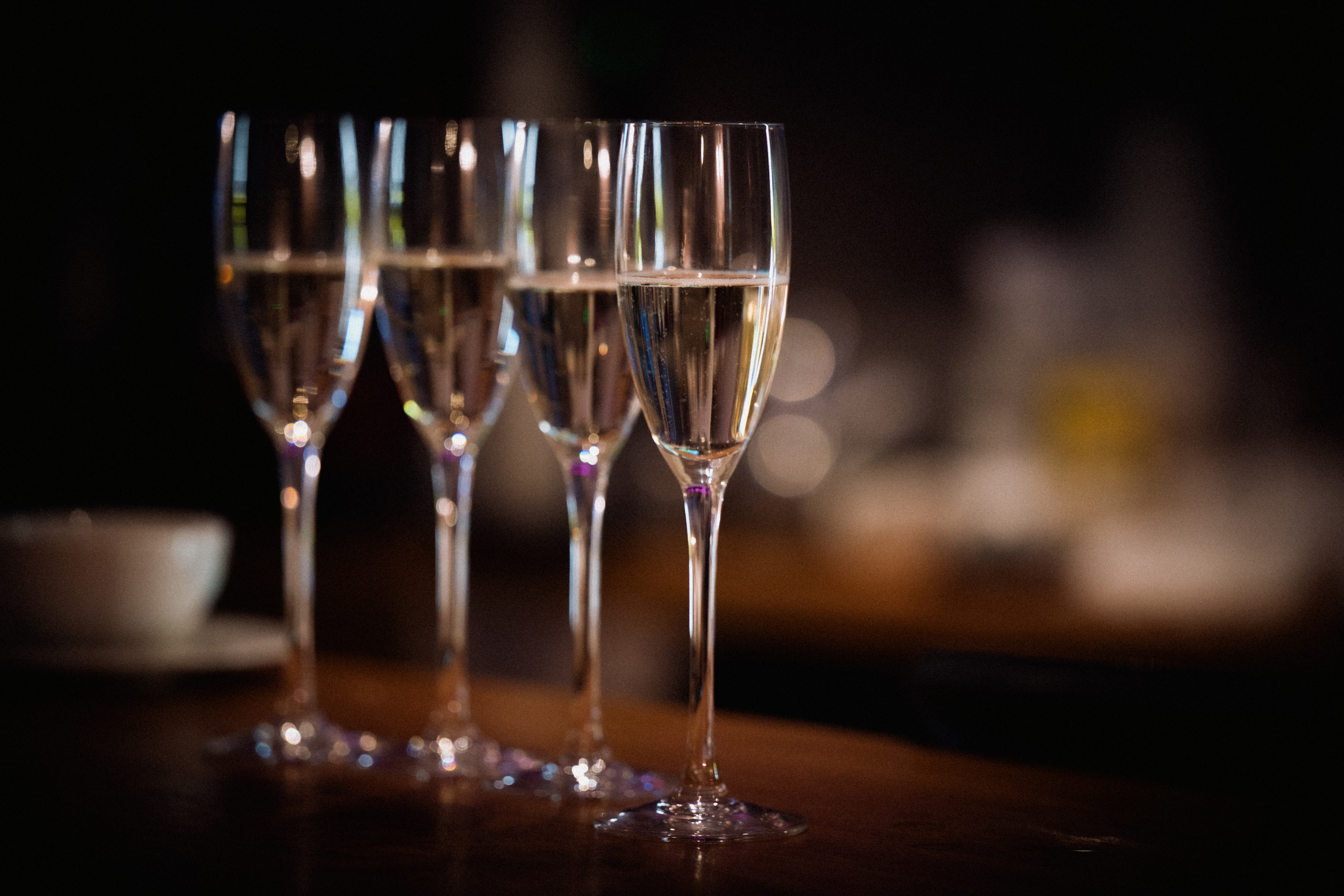 Champagne flutes poured and waiting in soft candlelight at Sheene Mill