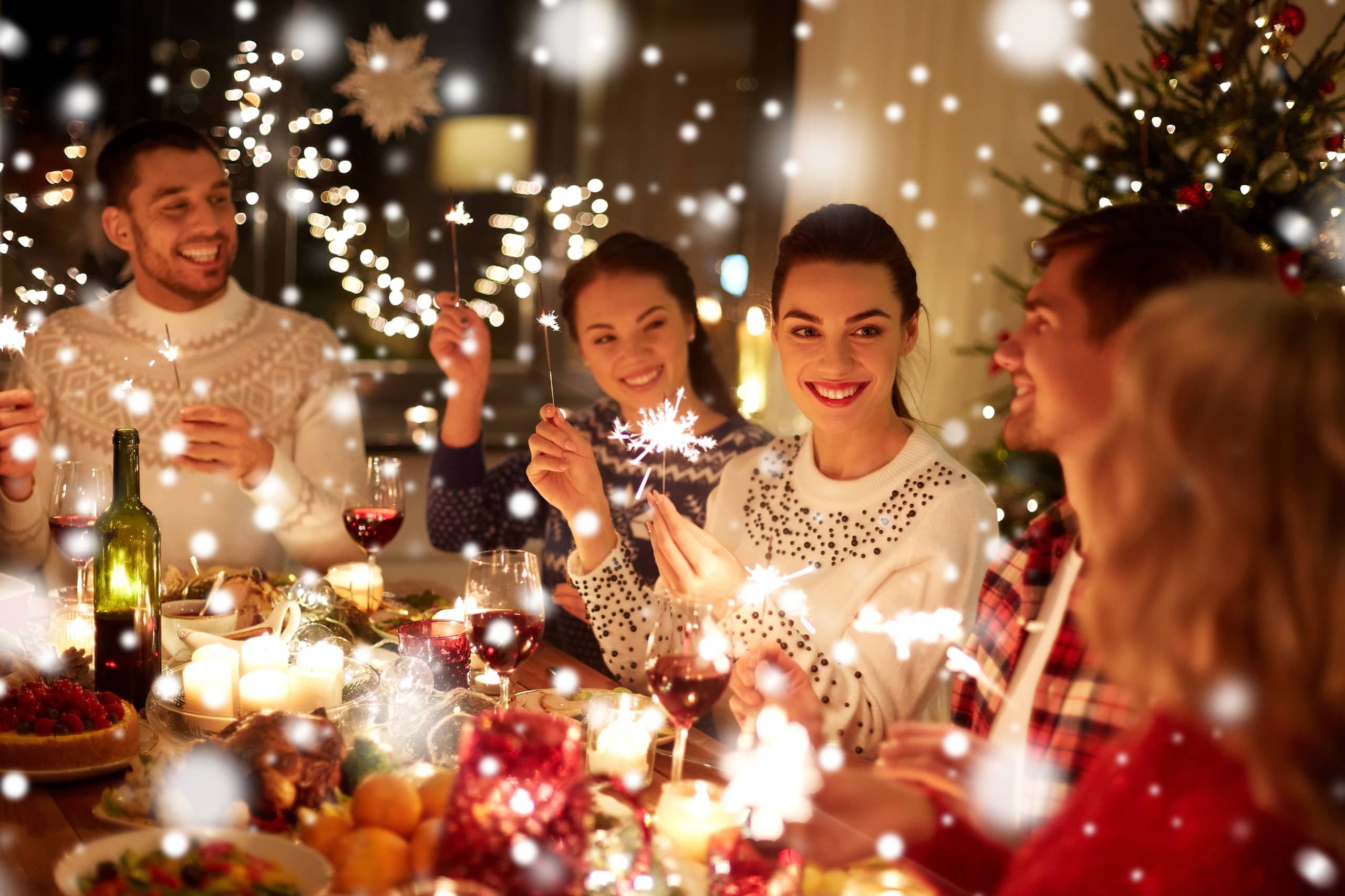 Guests celebrating with sparklers at a festive Christmas party dinner at Sheene Mill, Melbourn, Cambridgeshire