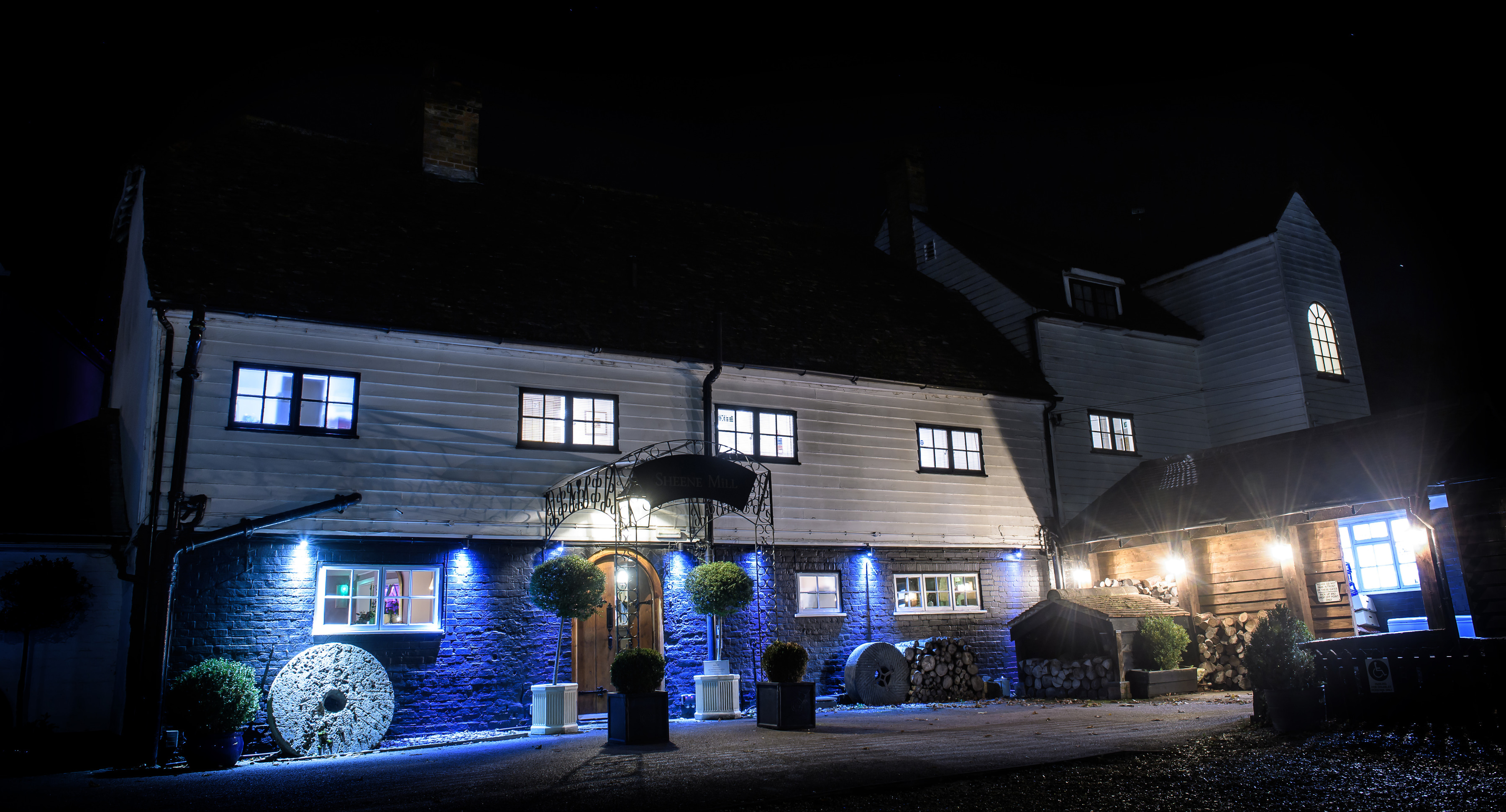 The mill house at Sheene Mill lit up at night