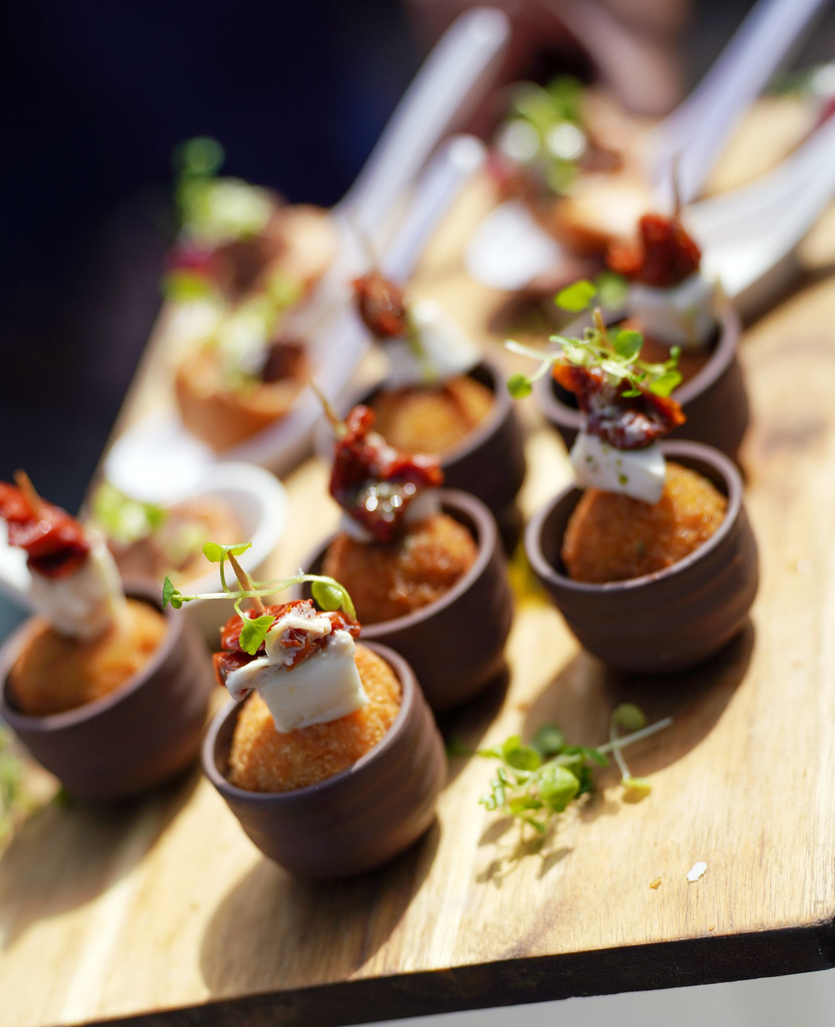 A wooden board of wedding canapés served at Sheene Mill