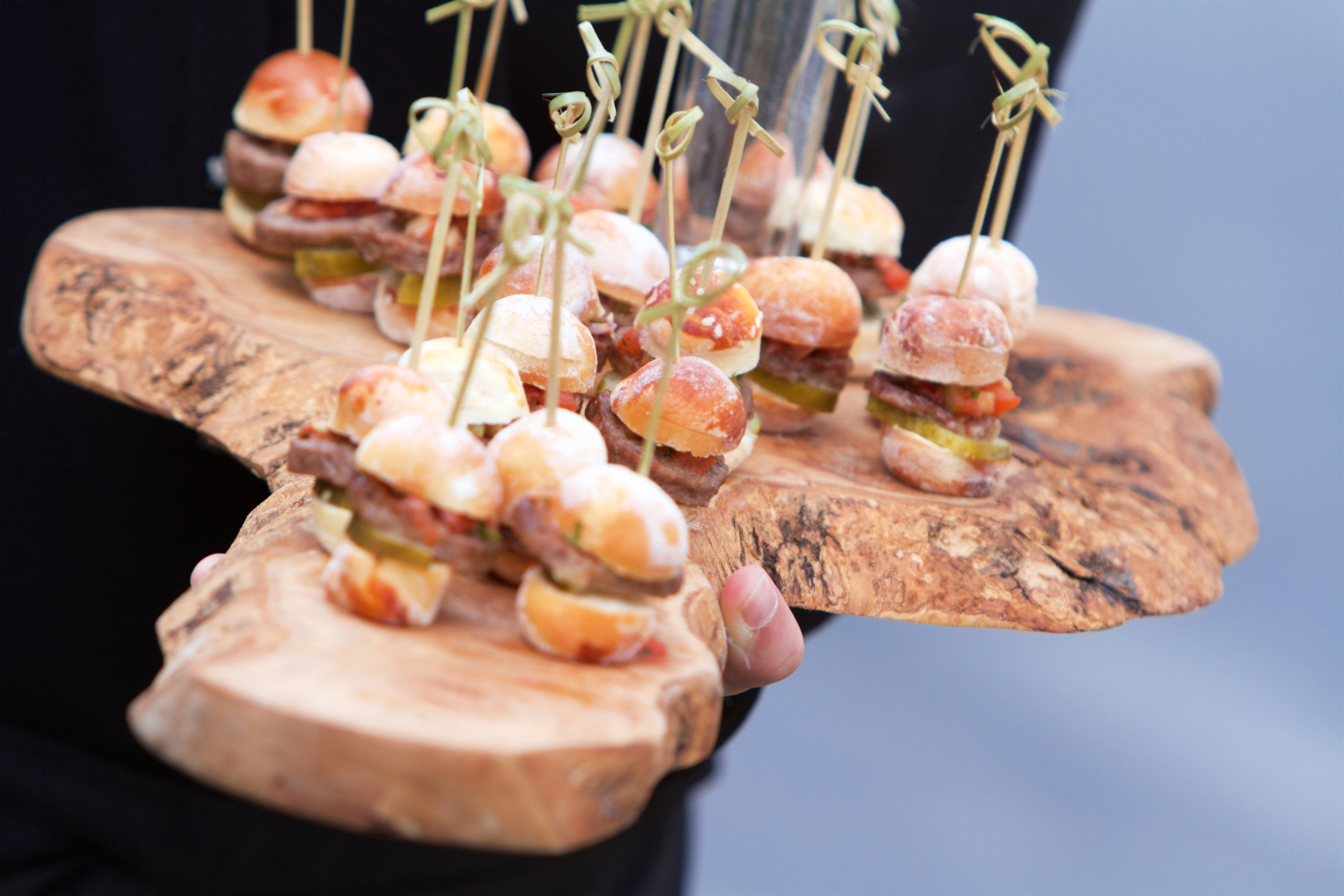 Canapes served on a rustic wooden board at a Sheene Mill wedding reception