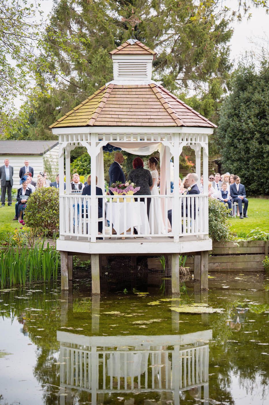 Wedding ceremony beside the River Mel at Sheene Mill, Cambridgeshire